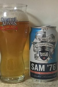 A can and a glass of sam adams