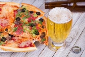 Pepperoni pizza and pale ale beer