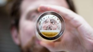 Man drinking skunked beer