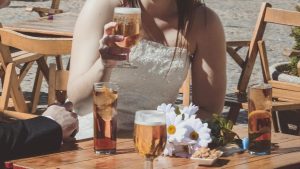 Wedding couple having beer for wedding