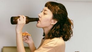 Woman drinking beer from a bottle